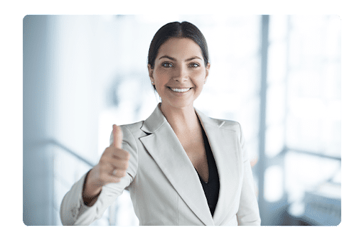Woman in a suit giving a thumbs up